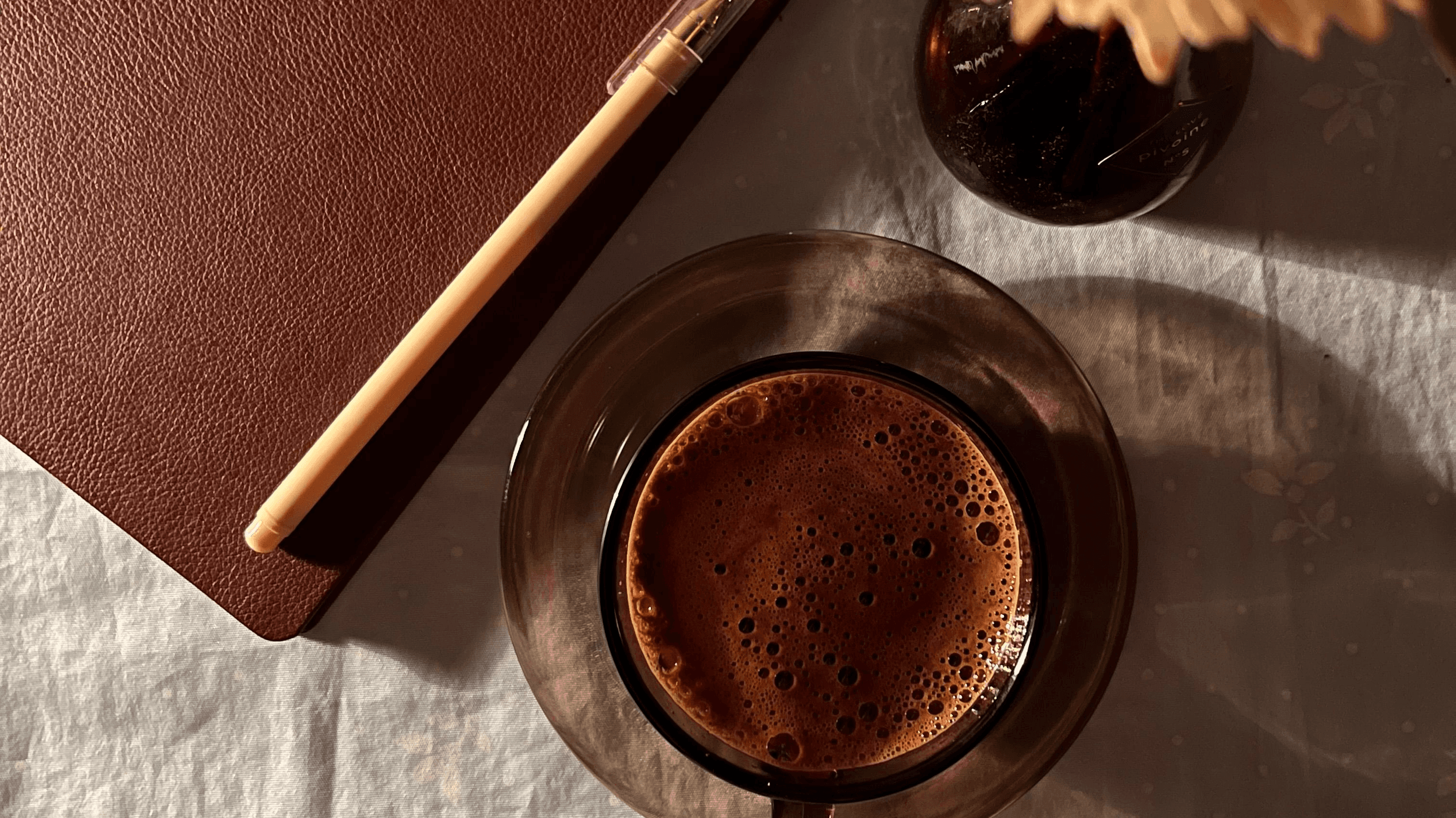 Elegant creative workspace with journal and coffee